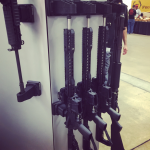 Raptor Products, Inc. Booth at NMGCA - View of 4 Raptor Picatinny Mounts™ and 4 Raptor Barrel Brackets™ securing 3 AR15s and a 870 Shotgun.